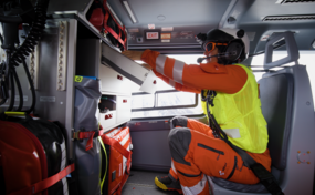 Rega emergency flight physician fetches medication from the cabinet in the cabin