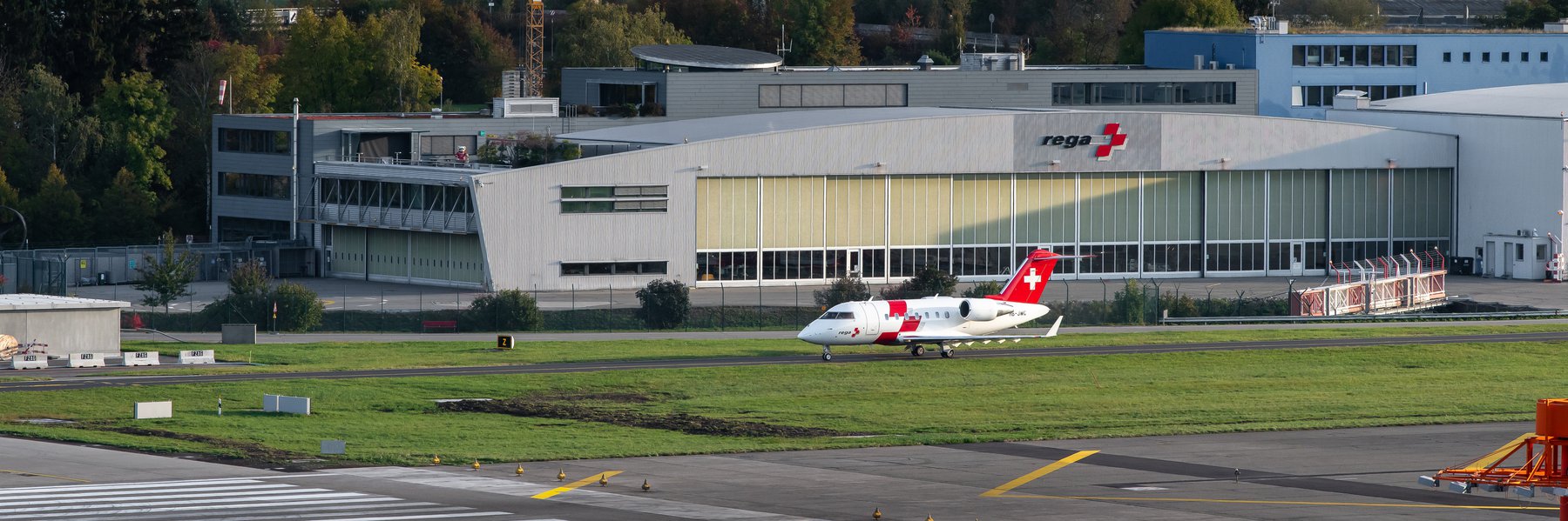 Ambulance jet in front of the Rega Centre on the way to the runway
